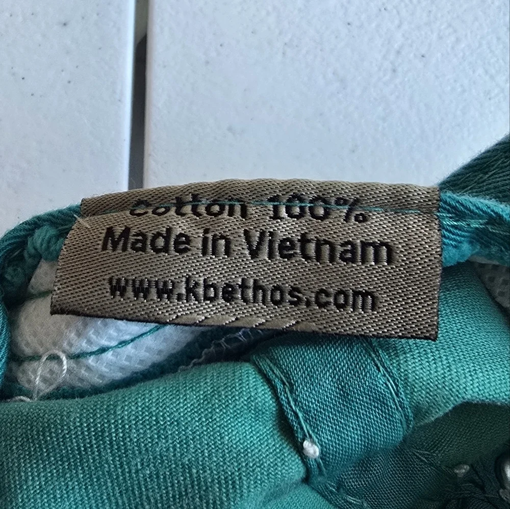 Kbethos Vintage Embroidered Teal Cap with Floral Design.